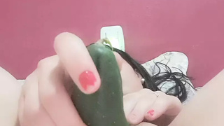 masturbates with small and chunky cucumber